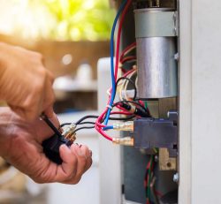 person working on wiring