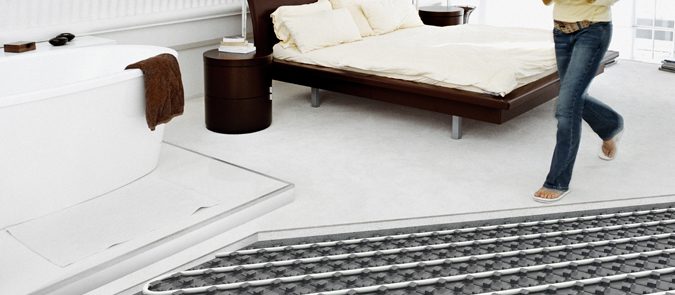 Person walking through their room with underfloor heating
